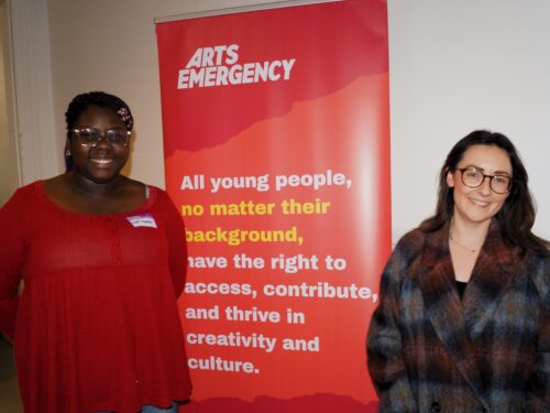 A black girl aged 17 standing next to a white woman in her 30s, they are both smiling