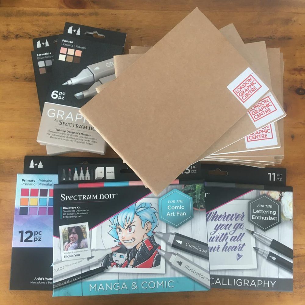 A selection of notebooks, pens and pencils