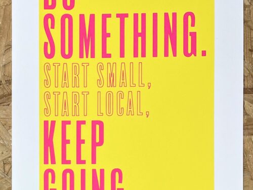 A yellow A4 page with bright pink text reading 'Do something. Start small, start local, keep going screen print.'